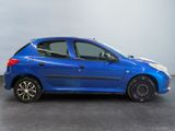 a picture of a small blue car parked in a garage
