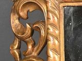 a picture of a gold frame with a mirror in it