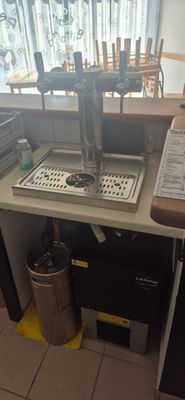 a kitchen with a sink and a faucet on the counter