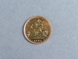 a gold coin with a picture of a man riding a horse on it