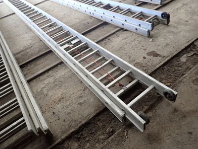 four ladders that are sitting on the ground