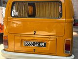 a yellow van that is parked in a garage