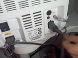 a person that is plugging in to a tv