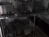 a kitchen with a lot of appliances in it