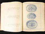an open book with blue and white designs on it