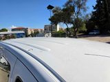 a white van that is parked on the side of the road