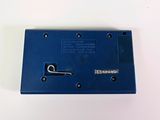 a small blue device that is on a white surface