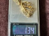 a gold ring sitting on top of a digital scale
