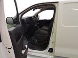 a white van with the door open and the driver ' s seat down