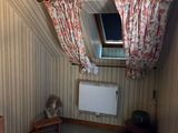 a small room with a window and a radiator in it