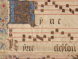 a close up of a manuscript with music notes on it