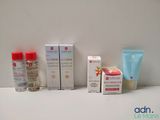 many different types of skin care products displayed on a table