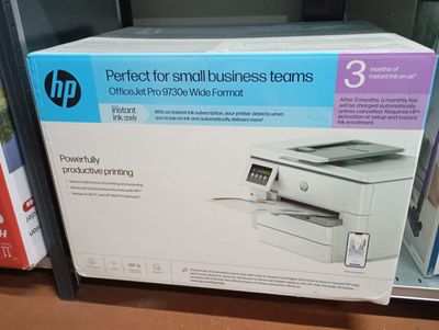 a box of printer sitting on a shelf in a store