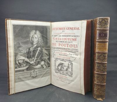 an open book with a picture of a man sitting at a table