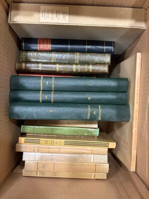 a box full of books that are stacked on top of each other
