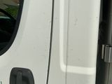graffiti on the side of a white truck with the door open