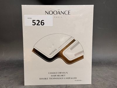 La boîte de la souris sans fil Noorance est ouverte sur la table.