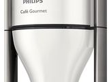 the coffee maker has a glass container on top of it