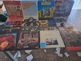 a lot of records on a table in a room