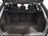 a trunk of a car with the back seats folded open