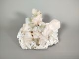 a small piece of rock with a lot of crystals on top of it