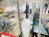 a glass display case in the middle of a room