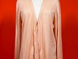 an orange cardigan sweater on a mannequin mannequin mannequin mannequin mannequin mannequin mannequin mannequin mann