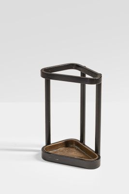 a black metal and wood side table on a white surface