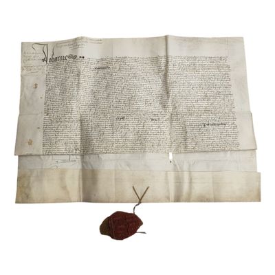 une feuille de papier sur laquelle est apposé un cachet de cire