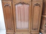 an image of a wooden cabinet with a glass door