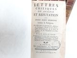 an old book that is sitting on top of a table