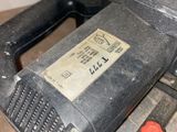 a picture of a sander sitting on top of a wooden table