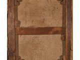 an old wooden frame with a picture of a person on it