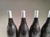 three bottles of wine that are sitting on a table
