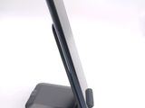 a cell phone that is sitting on a stand