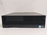 a close up of a black computer on a white surface