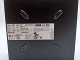 a close up of the back of a black box with a label on it