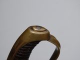 a close up of a metal object with a ring on it