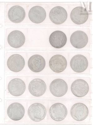 an image of a collection of silver coins on a sheet of paper