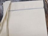 a close up of a piece of cloth on a wooden table