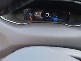 the dashboard of a car with a digital display on the dash