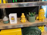 a shelf with various items on it in a room