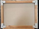 an image of a painting on a easel with a black background