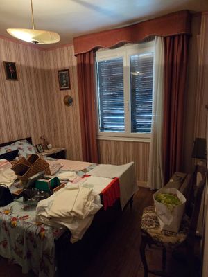 a bedroom with a bed and a window in it
