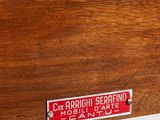 an image of a close up of a wooden drawer with a sign on it
