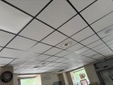 a clock that is on the ceiling of a room