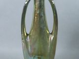 a green vase with a handle on a white background
