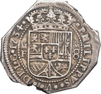 une vieille pièce d'argent sur laquelle figure un blason