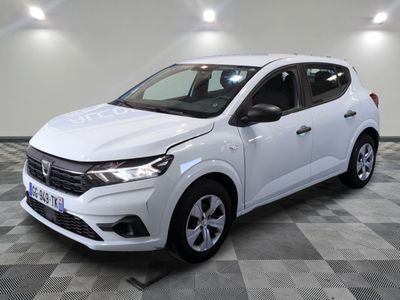 the white car is parked on a checkered floor in a room