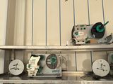 many different types of machines on the shelves in the room